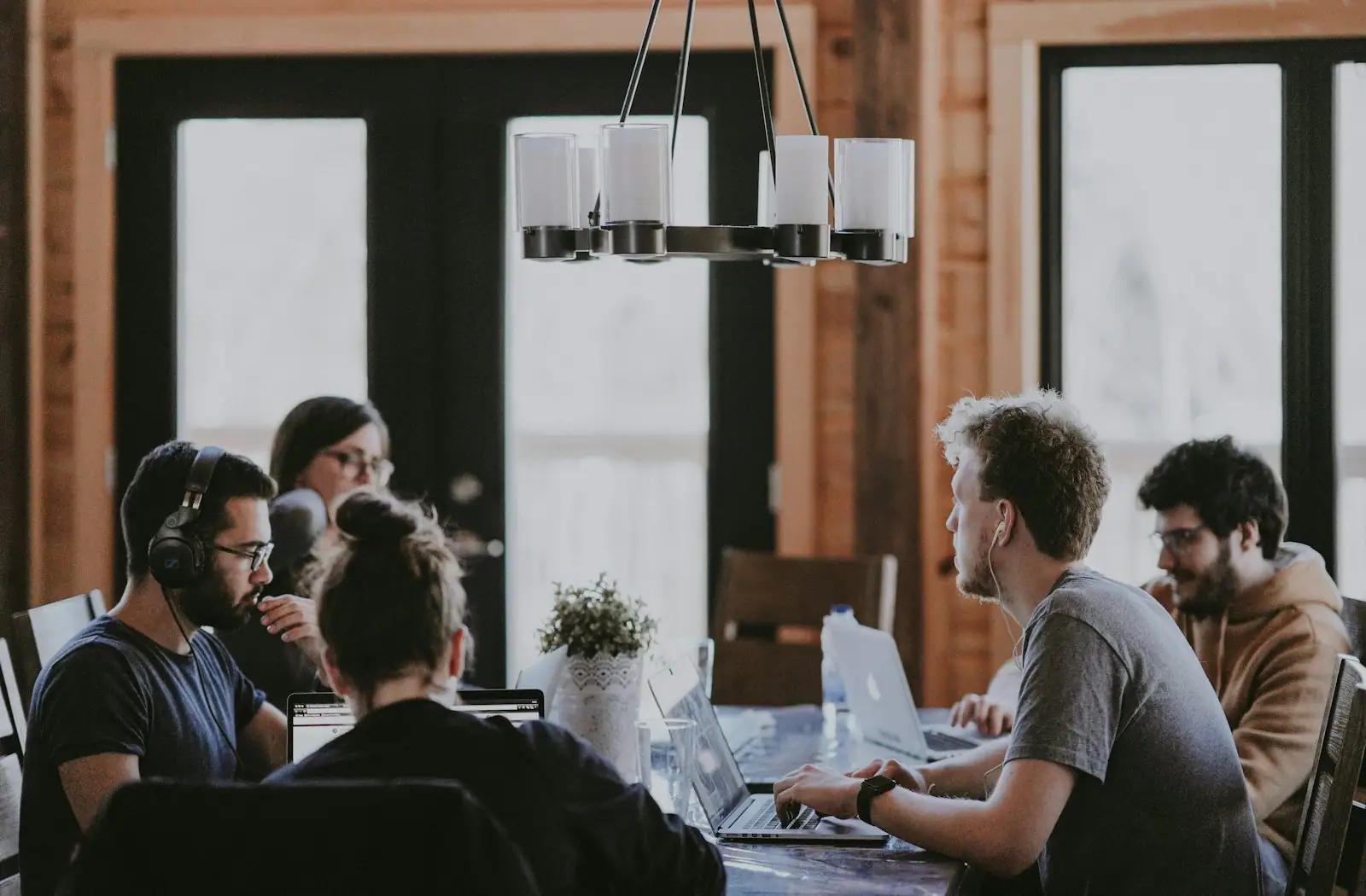 Technology delivery team working together in an open office